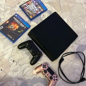 Sony PlayStation 4 Slim Gaming Black Console with 2 controllers and 2 games